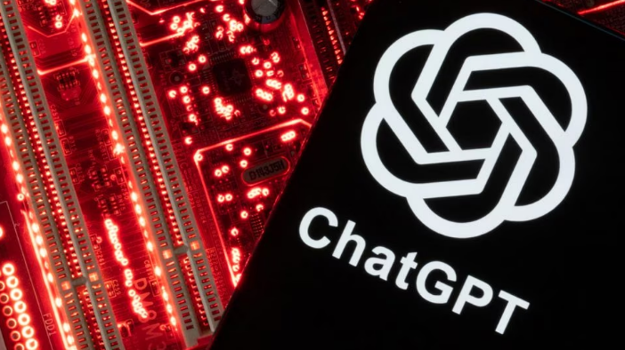 A smartphone with a displayed ChatGPT logo is placed on a computer motherboard in this illustration taken February 23, 2023. /Reuters