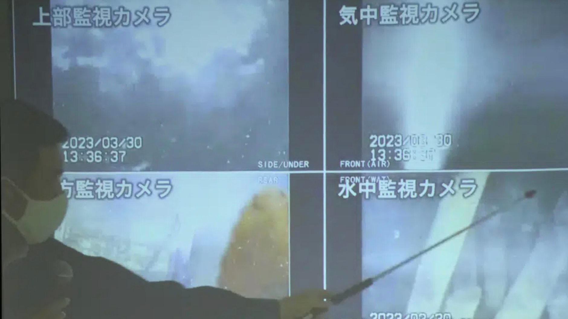A spokesperson for the TEPCO shows photos captured by a robotic probe inside one of the three melted reactors at the tsunami-wrecked Fukushima nuclear power plant, during a news conference at the TEPCO headquarters in Tokyo, Japan, April 4, 2023. /CFP