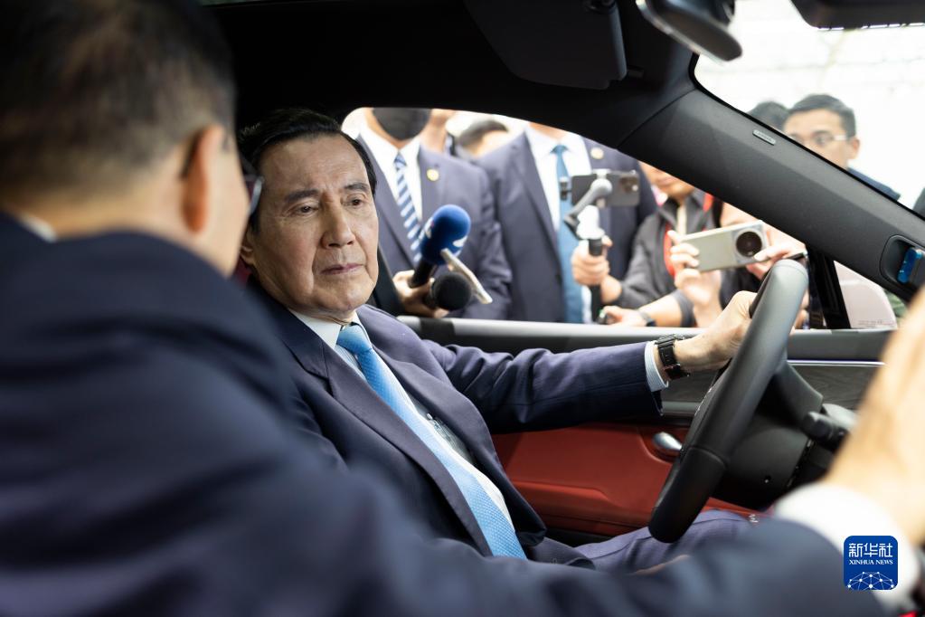 Ma Ying-jeou takes a test drive of a car in Seres Group's smart factory in Chongqing, southwest China, April 4, 2023. /Xinhua