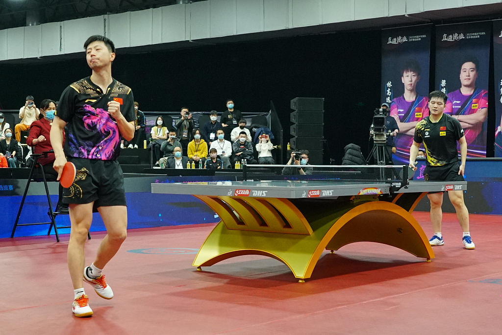 Ma Long (L) and Fan Zhendong compete in the men's singles at the national trial for the 2023 World Table Tennis Championships in Beijing, February 23, 2023. /CFP