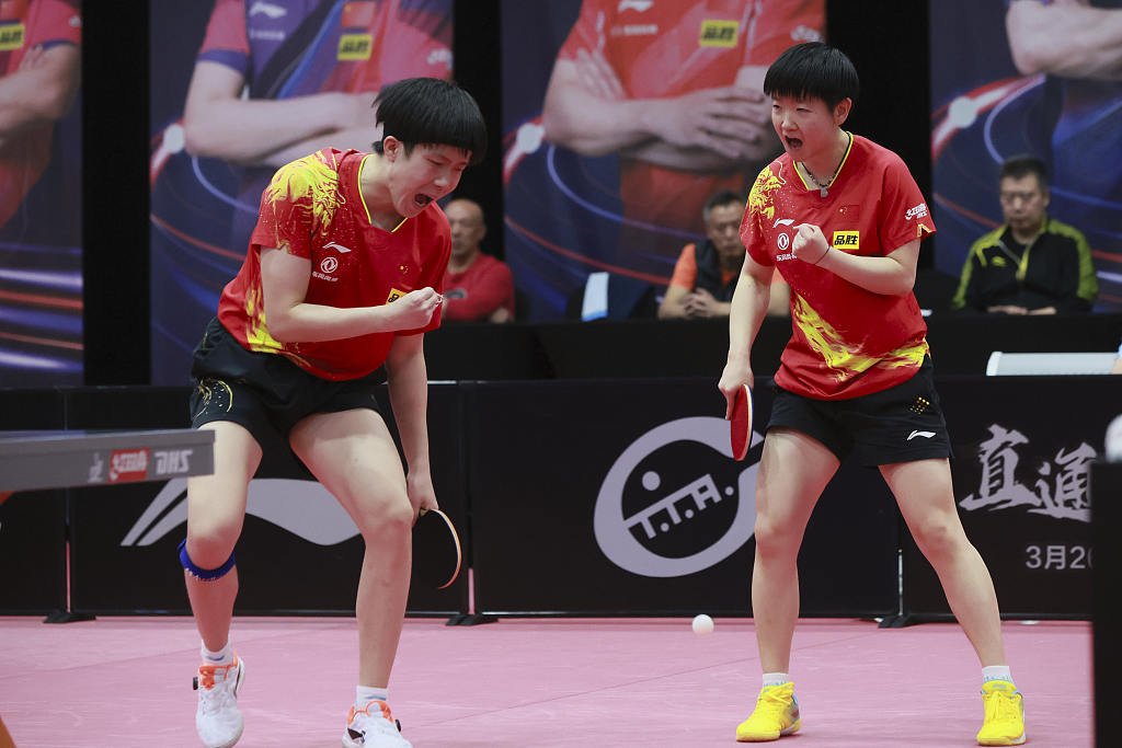 Wang Chuqin (L) and Sun Yingsha compete in the mixed doubles at the national trial for the 2023 World Table Tennis Championships in Beijing, March 29, 2023. /CFP