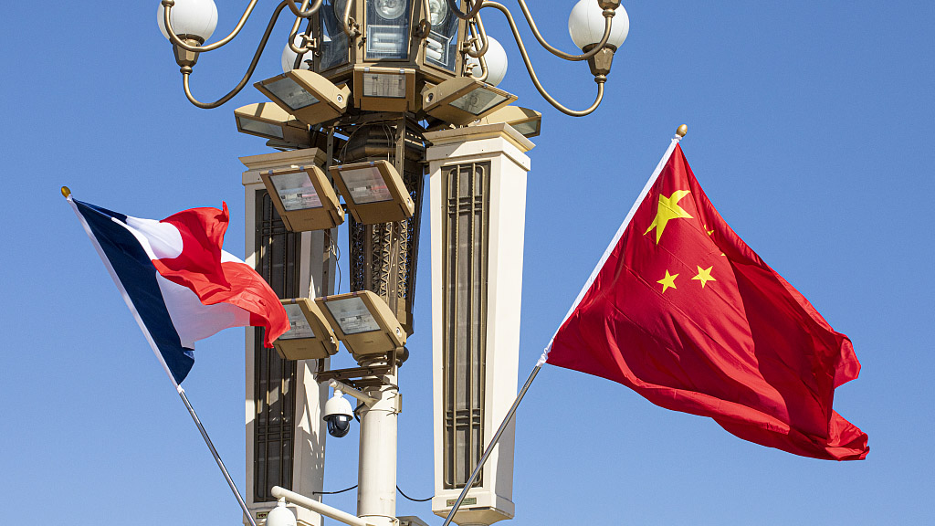 The national flags of China and France are hoisted on Tiananmen Square in Beijing to welcome French President Emmanuel Macron's visit to China, April 7, 2023. /CFP
