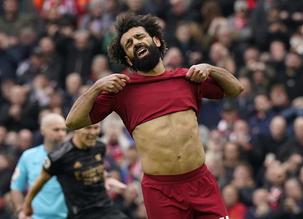 Mohamed Salah of Liverpool reacts to sending a penalty kick wide of the goal during his team's Premier League match against Arsenal at Anfield in Liverpool, England, April 9, 2023. /CFP