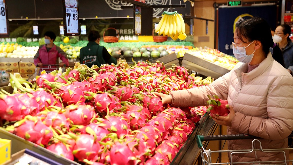 A shopper at a supermarket in east China's Jiangsu Province, April 11, 2023. /CFP
