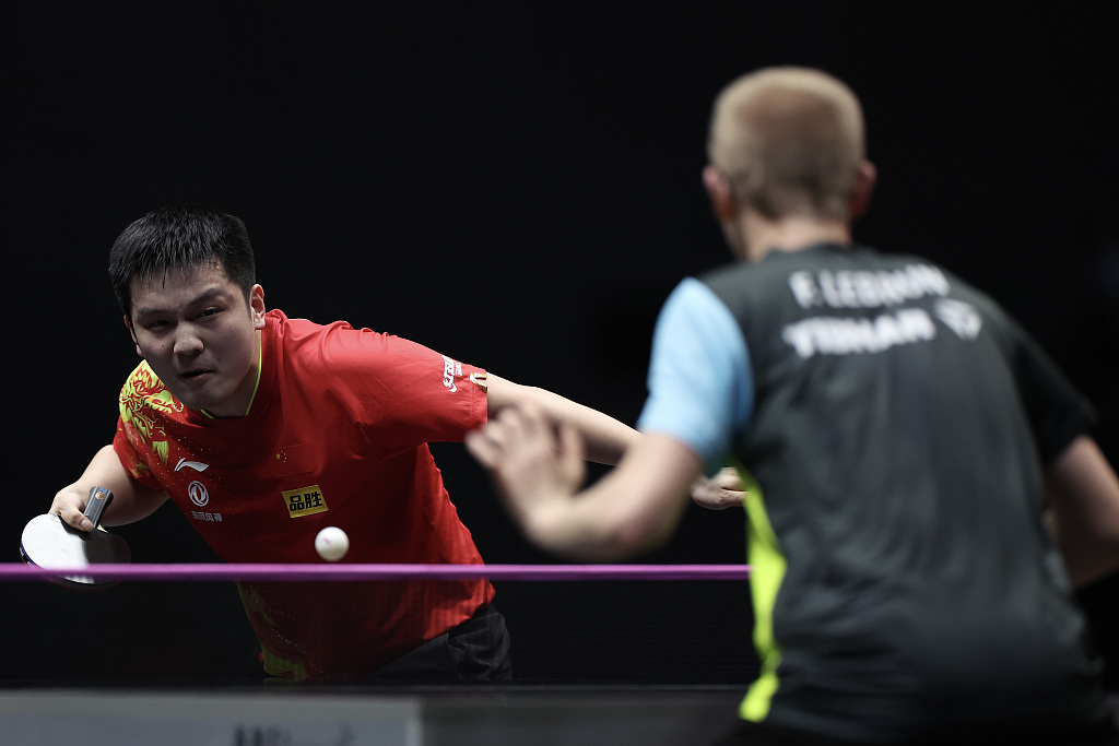 Fan Zhendong (L) plays in the men's singles match at WTT Champions Xinxiang in central China's Henan Province, April 10, 2023. /CFP