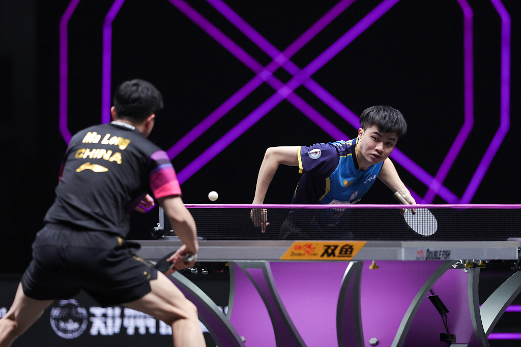 Ma Long (L) of China and Lin Yun-Ju of Chinese Taipei in action during their round of 16 match at the WTT Champions event in Xinxiang, China, April 11, 2023. /CFP