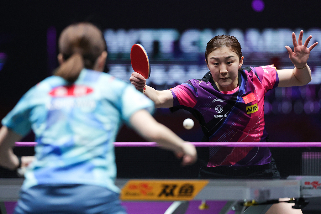 Chen Meng (R) of China hits a return against Ishikawa Kasumi of Japan during the WTT Champions event in Xinxiang, China, April 11, 2023. /CFP