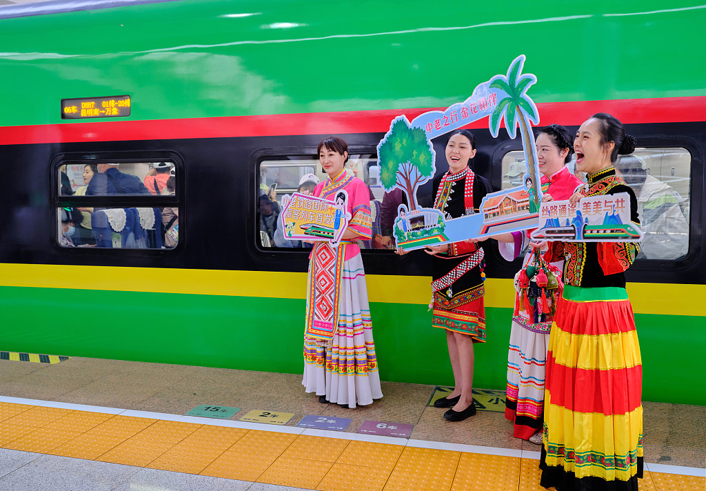 Staff members of the first cross-border passenger train of China-Laos Railway which departs from Kunming, capital of southwest China's Yunnan Province, heading for the Lao capital Vientiane, April 13, 2023. /CFP