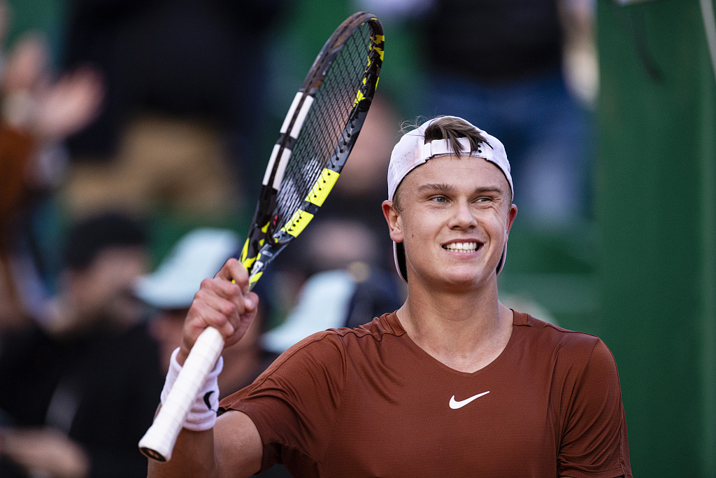 Holger Rune of Denmark celebrates after beating Dominic Thiem of Austria at the Monte Carlo Masters in Monaco, April 12, 2023. /CFP