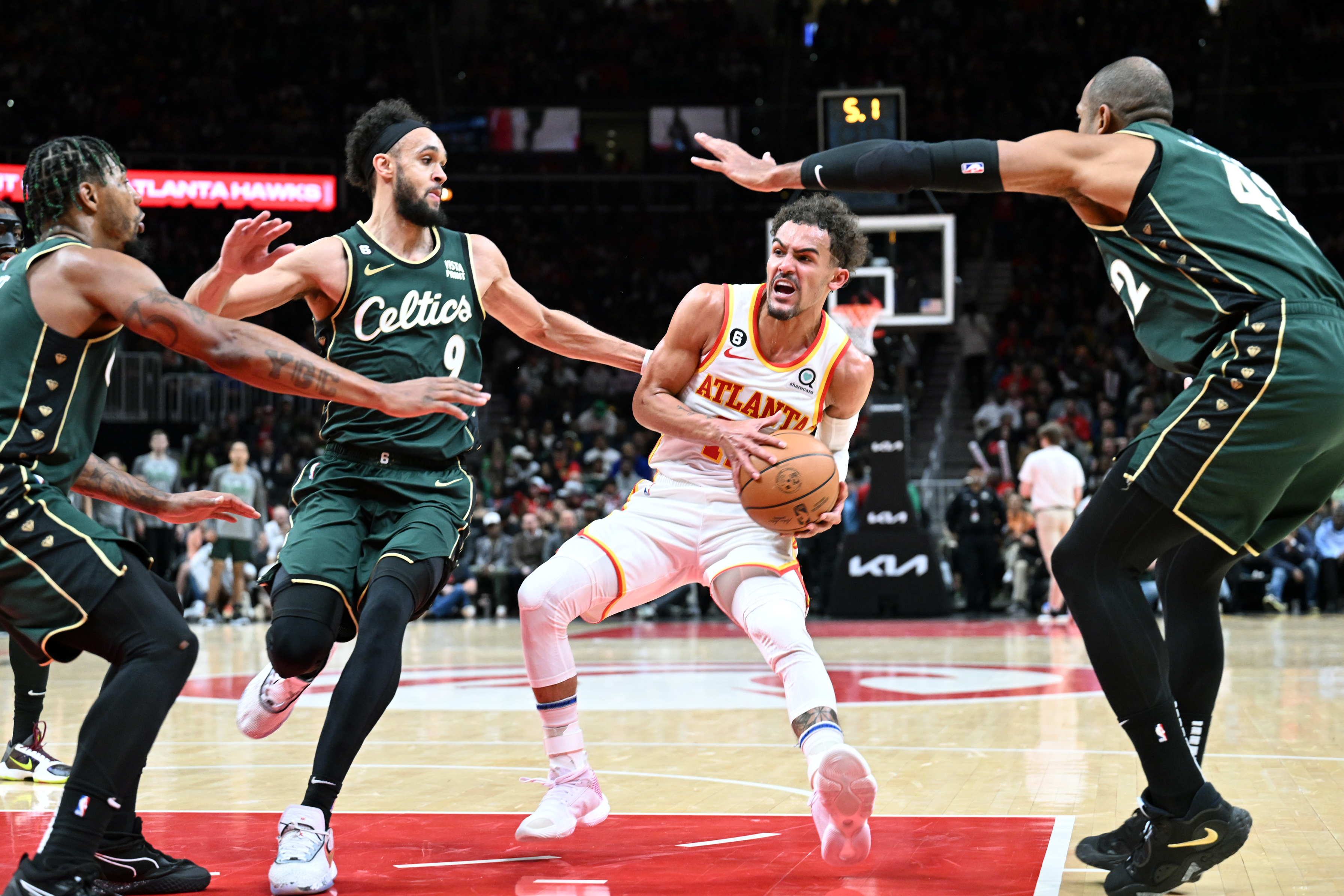 Trae Young (C) of the Atlanta Hawks is surrounded by defenders of the Boston Celtics in the game at State Farm Arena in Atlanta, Gerogia, March 11, 2023. /CFP
