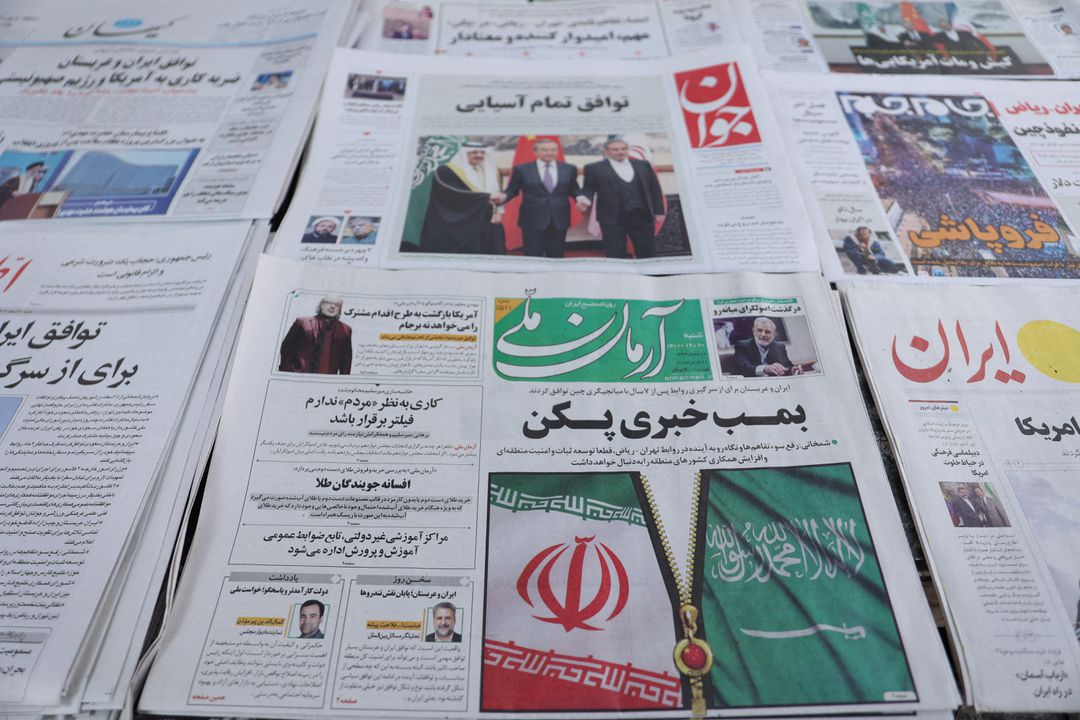 A newspaper with a cover picture of the flag of Iran and Saudi Arabia, is seen in Tehran, Iran, March 11, 2023. Majid Asgaripour/WANA (West Asia News Agency) via Reuters