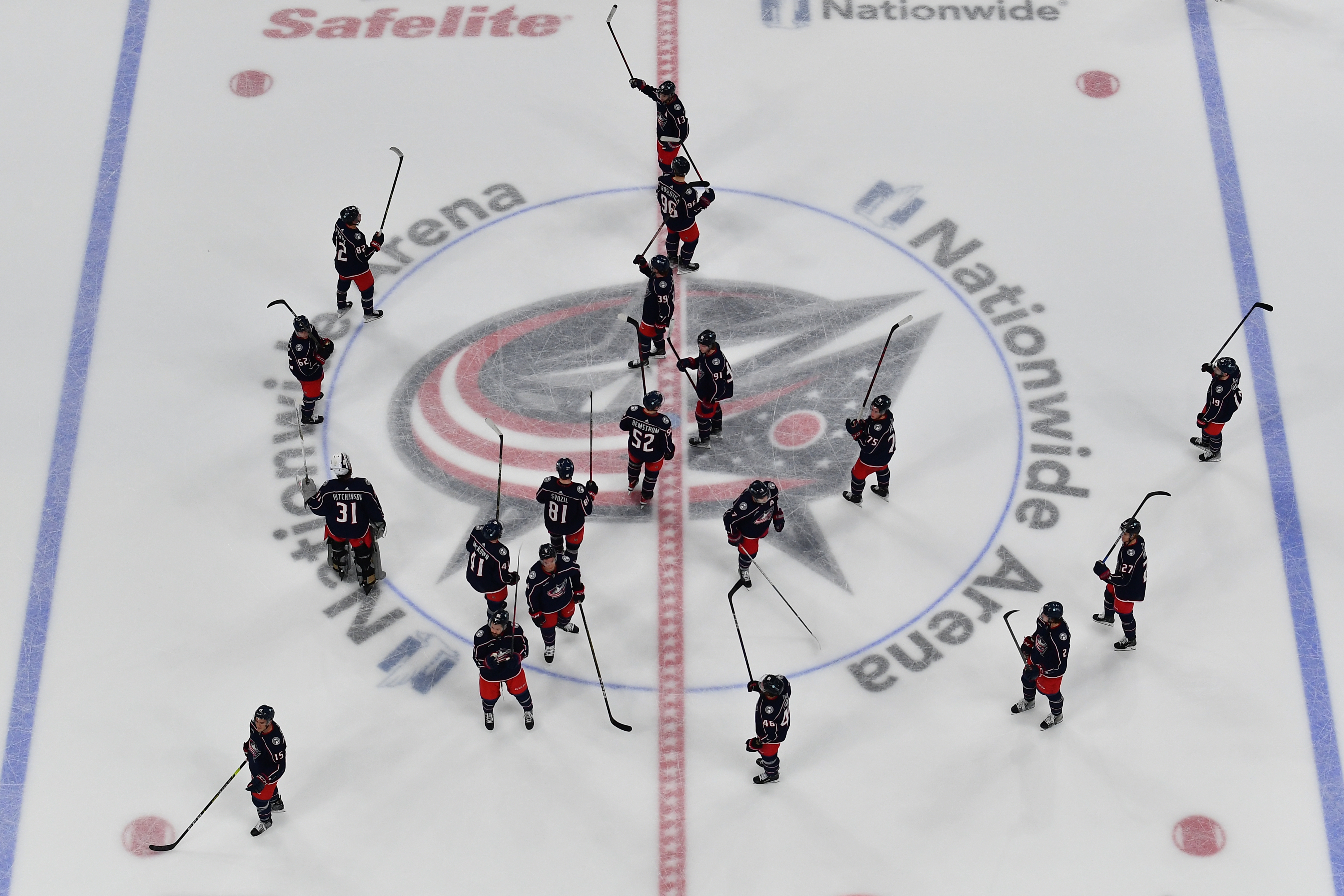 Columbus Blue Jackets players raise their sticks and salute the fans after the 5-2 loss against the Buffalo Sabres at Nationwide Arena in Columbus, Ohio, April 14, 2023. /CFP