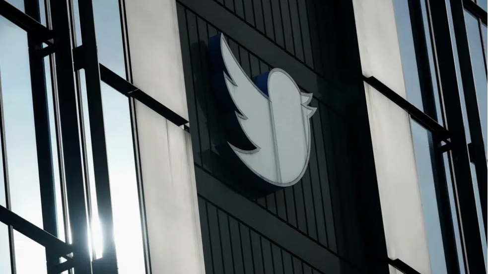 A Twitter logo hangs outside the company's offices in San Francisco, December 19, 2022. /AP