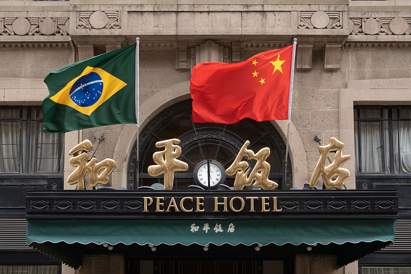 The national flags of Brazil and China are seen at the Peace Hotel in Shanghai, April 13, 2023. /CFP