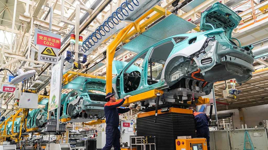 Workers operate at a car production plant in north China's Shanxi Province, March 24, 2023. /CFP
