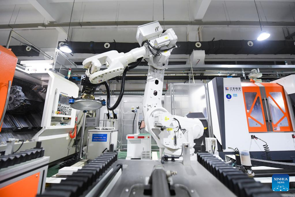 An industry robot works at the analysis and testing center of Konfoong Materials International Co., Ltd. in Ningbo, east China's Zhejiang Province, March 21, 2023. /Xinhua