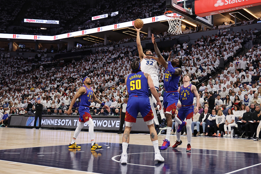 Karl-Anthony Towns (C) of the Minnesota Timberwolves shoots in Game 3 of the NBA Western Conference first-round playoffs against the Denver Nuggets at the Target Center in Minneapolis, Minnesota, April 21, 2023. /CFP