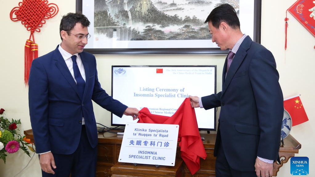 Chinese Ambassador to Malta Yu Dunhai (R) and Clarence Pace, director general of the Department for Health Services, Ministry for Health of Malta, and chairman of the board of the MRCTCM, inaugurate an insomnia specialist clinic in Paola, Malta, April 21, 2023. /Xinhua