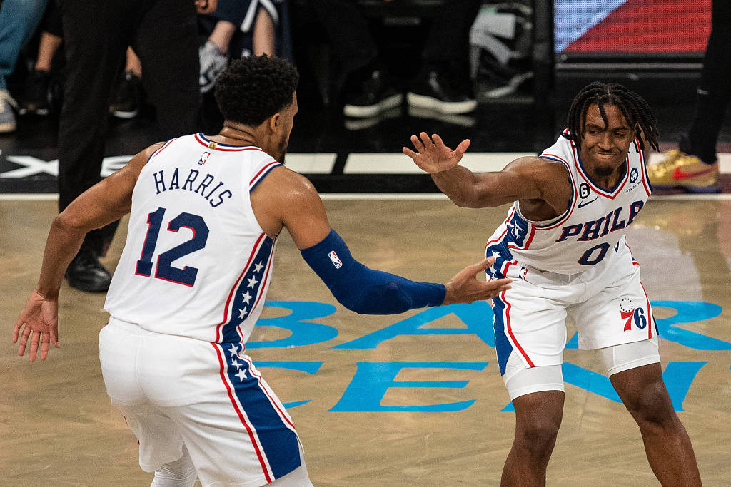 Tobias Harris (#12) and Tyrese Maxey of the Philadelphia 76ers celebrate after making a shot in Game 4 of the NBA Eastern Conference first-round playoffs against the Brooklyn Nets at the Barclays Center in Brooklyn, New York, April 22, 2023. /CFP