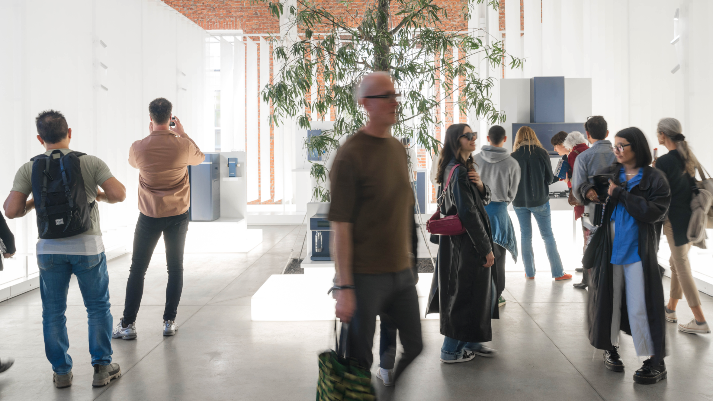 Visitors around Chinese design exhibition booth in 2023 Milan Design Week. /CGTN