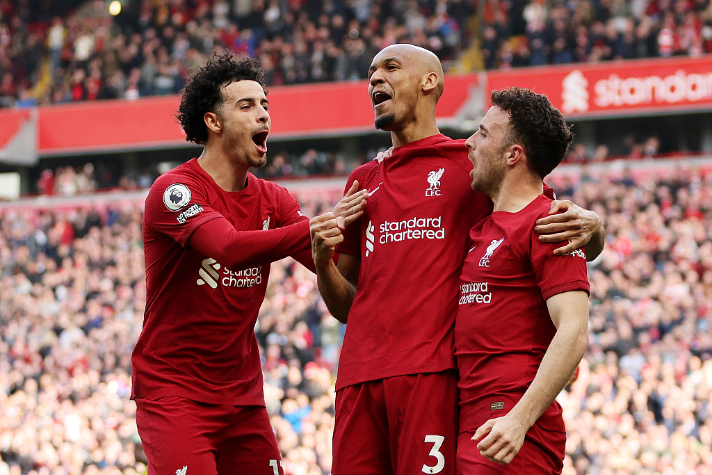 L-R: Liverpool's Diogo Jota, Fabinho and Curtis Jones celebrate their victory over Nottingham Forest after the Premier League match at Anfield in Liverpool, England, April 22, 2023. /CFP
