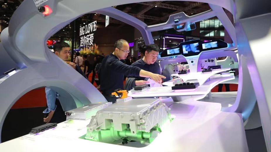 Visitors look at models of on-board electronic devices displayed at the Bosch booth at the 20th Shanghai International Automobile Industry Exhibition in east China's Shanghai, April 18, 2023. /Xinhua