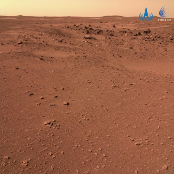 An image shows rocks distributed near impact craters on the surface of Mars, taken by the navigation terrain camera onboard Zhurong, April 10, 2022. /China National Space Administration via Xinhua