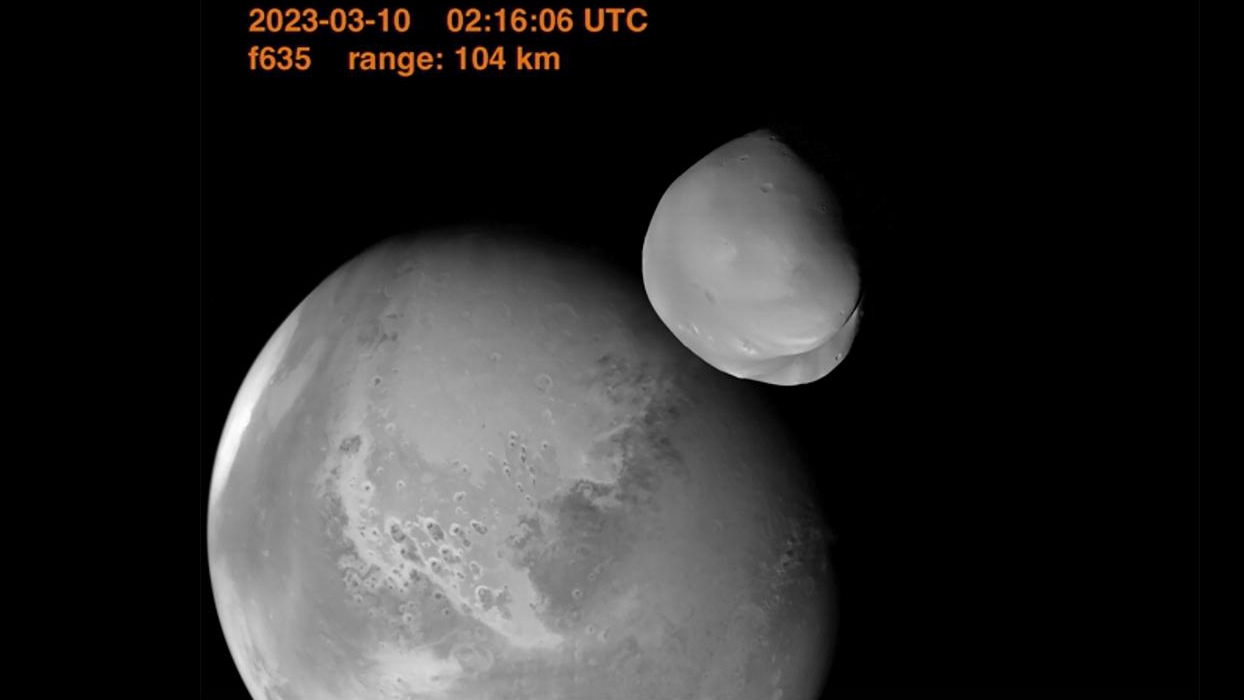 Mars and its little moon, Deimos. /AP