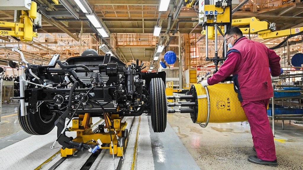 A worker operates at a car plant in east China's Shandong Province, January 31, 2023. /CFP