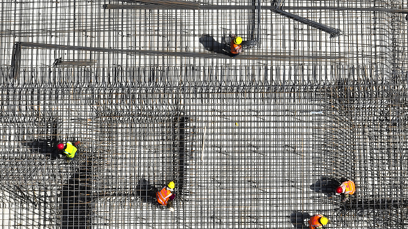 Workers at a construction site in Zaozhuang City, Shandong Province, China, April 30, 2023. /CFP