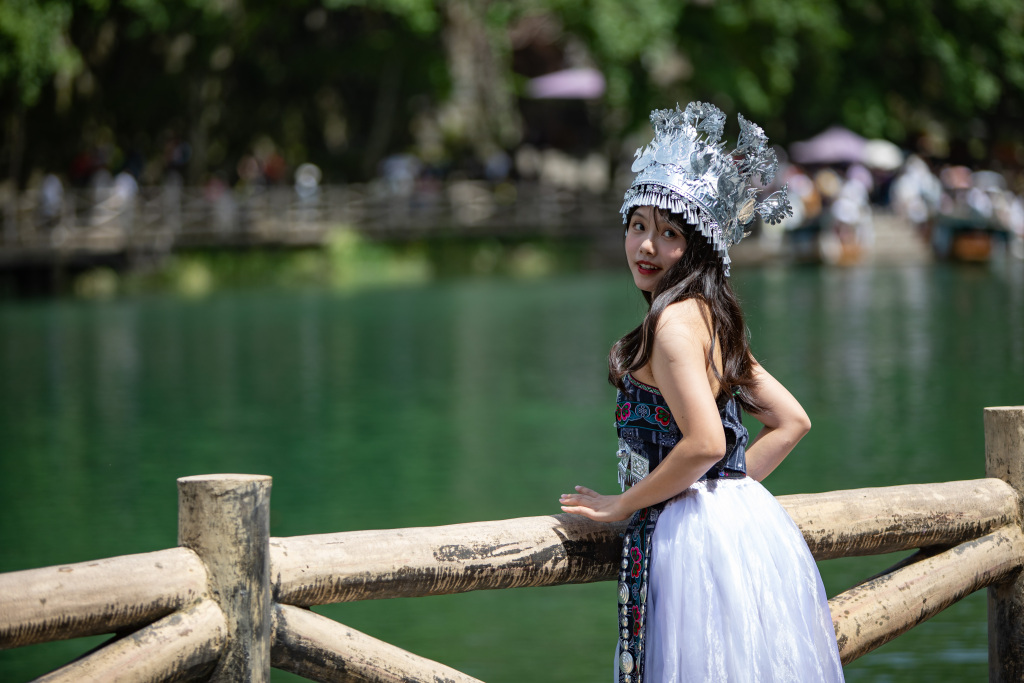 Tourists soak up the stunning scenery and unique folk culture at Hong'an Ancient Town in Xiushan Tujia and Miao Autonomous County, southwest China's Chongqing Municipality, on April 30, 2023. /CFP