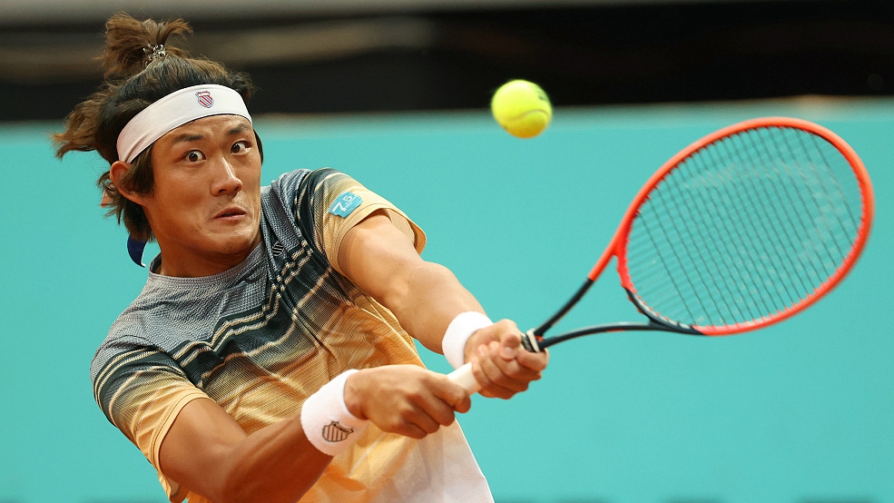 Zhang Zhizhen plays a backhand against Cameron Norrie during the Madrid Open at La Caja Magica in Madrid, Spain, May 1, 2023. /CFP