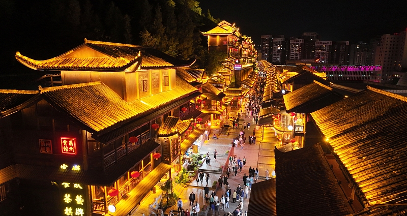 Youzhou Ancient Town in Chongqing is bathed in a sea of neon at night, creating a fairytale-like scene. /CFP
