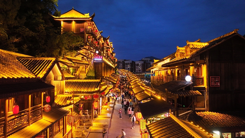 Youzhou Ancient Town in Chongqing is bathed in a sea of neon at night, creating a fairytale-like scene. /CFP