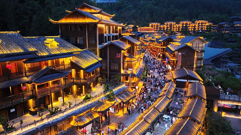 Youzhou Ancient Town in Chongqing is bathed in a sea of neon at night, creating a fairytale-like scene. /CFP