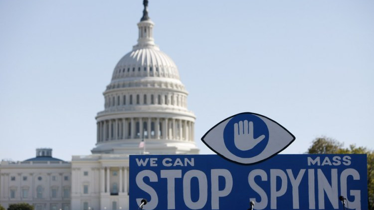 A huge slogan board stands in front of the U.S. Capitol building during a protest against government surveillance in Washington D.C., capital of the United States, October 26, 2013. /Xinhua