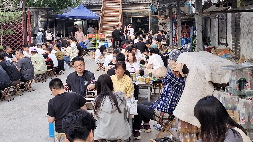 Tourists enjoy barbecue at a street in Zibo City, east China's Shandong Province, May 1, 2023. /CFP