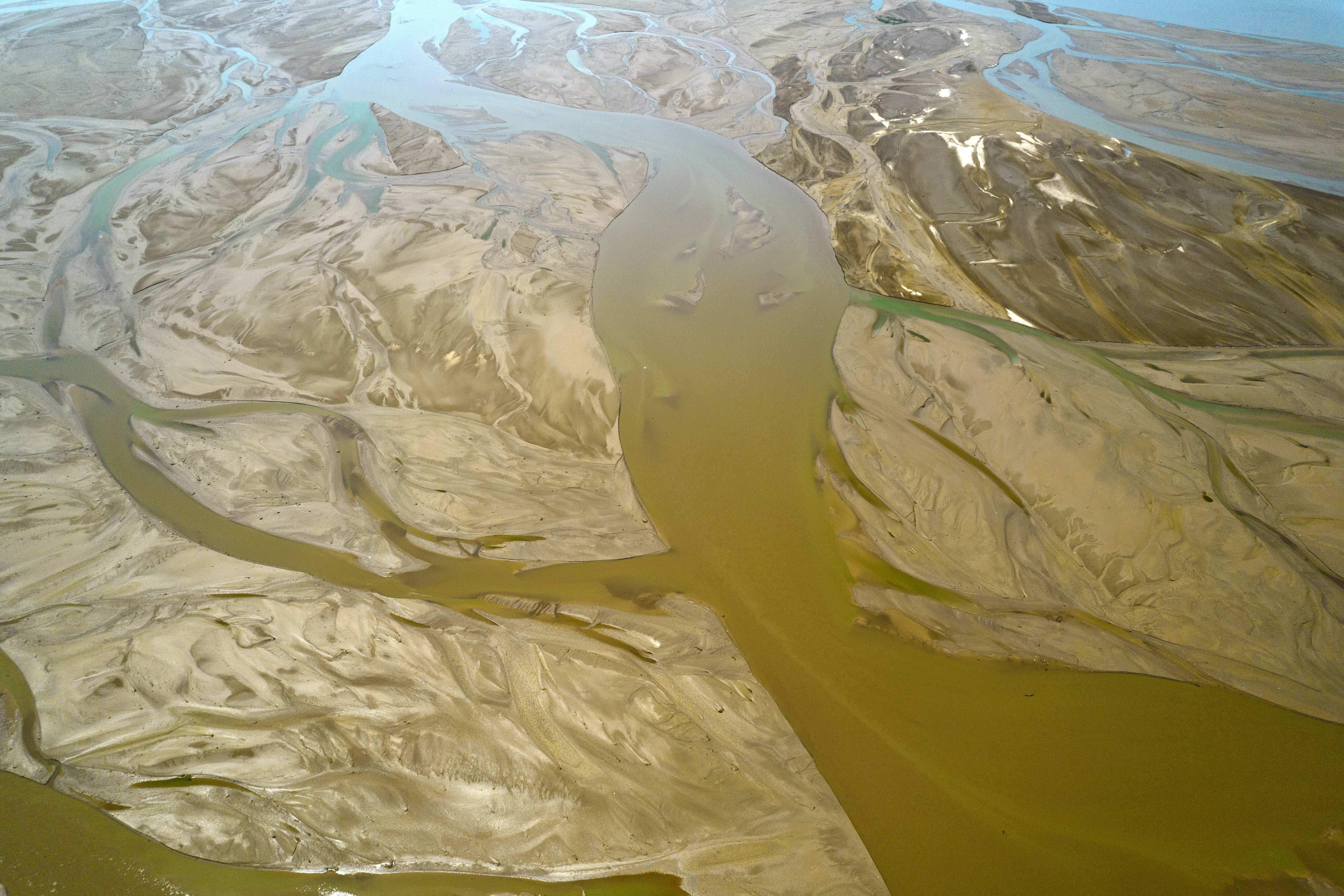 Beautiful branch-like shapes are formed by changes in the river and sand bed at the Yongji Section of the Yellow River in Shanxi, as captured in this stunning aerial photo taken on May 2, 2023. /CNSPHOTO