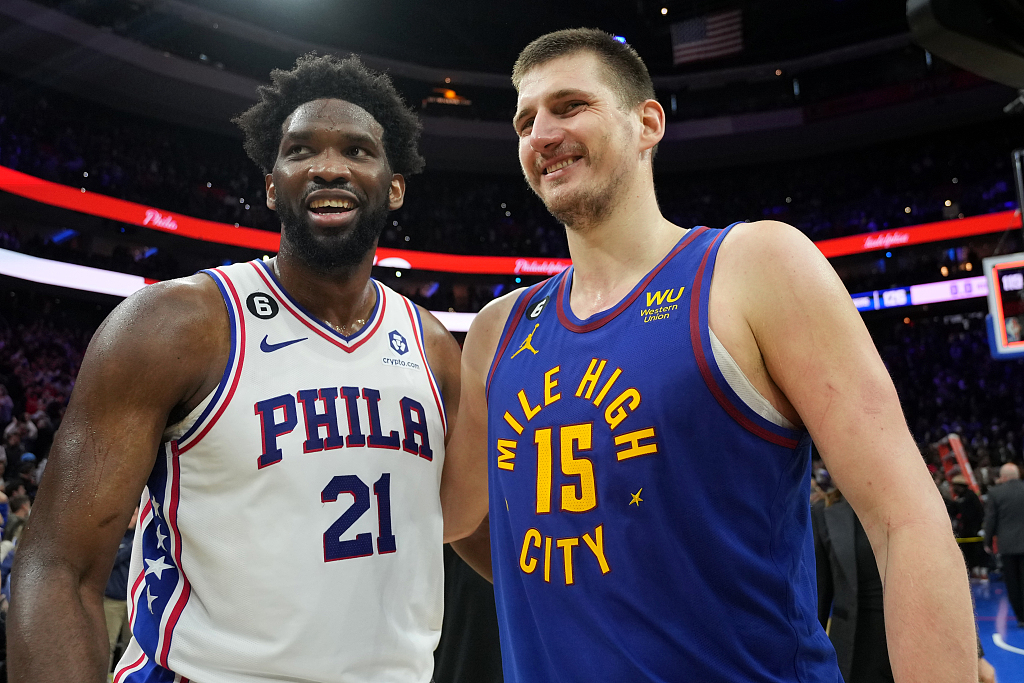 Joel Embiid (#21) of the Philadelphia 76ers and Nikola Jokic of the Denver Nuggets look on after the game at the Wells Fargo Center in Philadelphia, Pennsylvania, January 28, 2023. /CFP