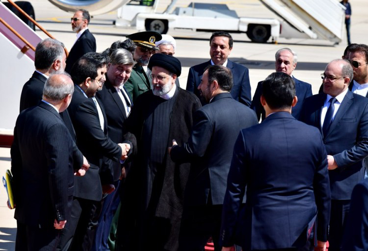 Iranian President Ebrahim Raisi shakes hands with Syrian officials upon his arrival at Damascus International Airport in Damascus, Syria, May 3, 2023. /Xinhua