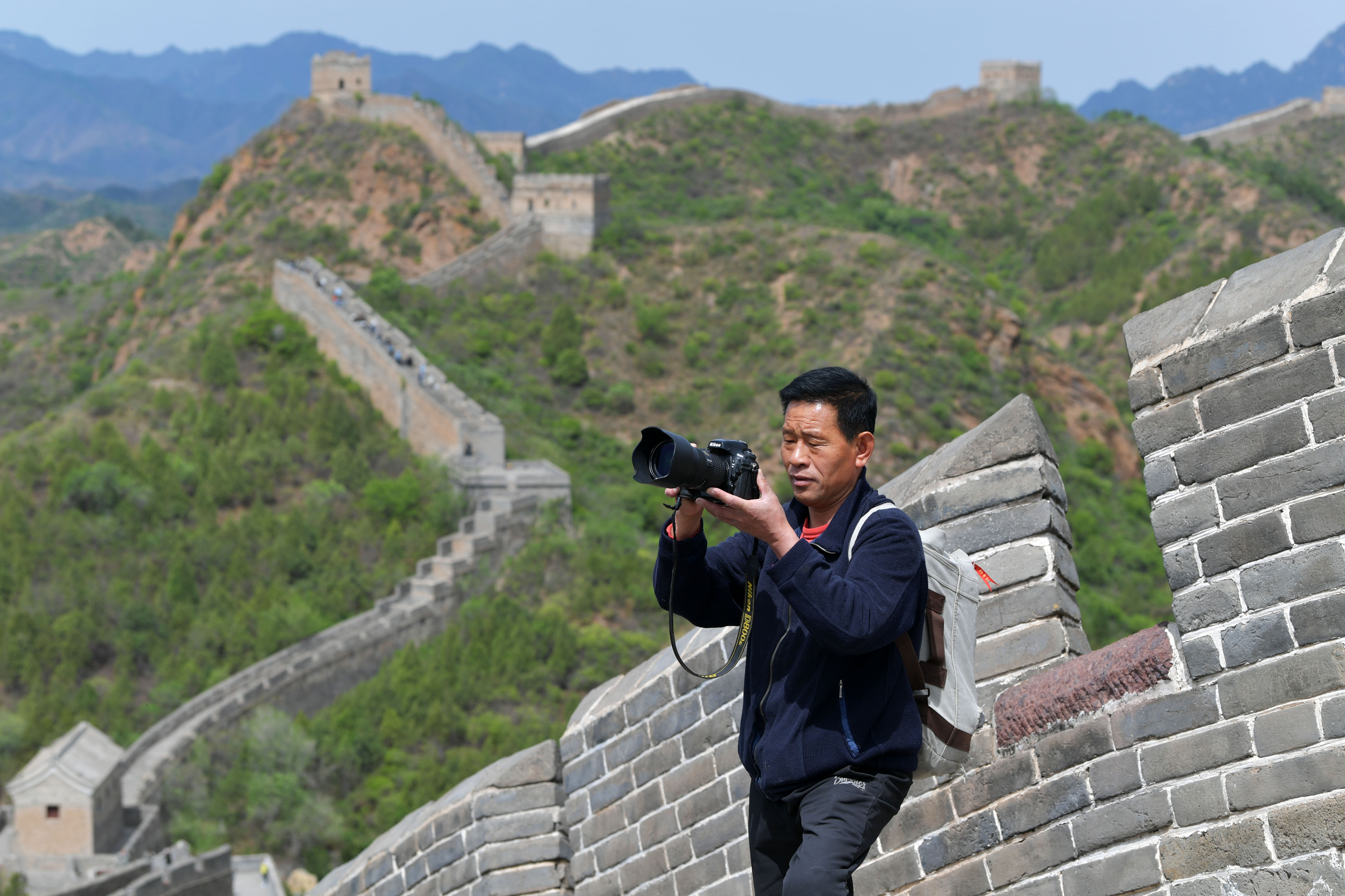 Zhou Wanping has been taking photos of the Great Wall for decades. / CNSPHOTO