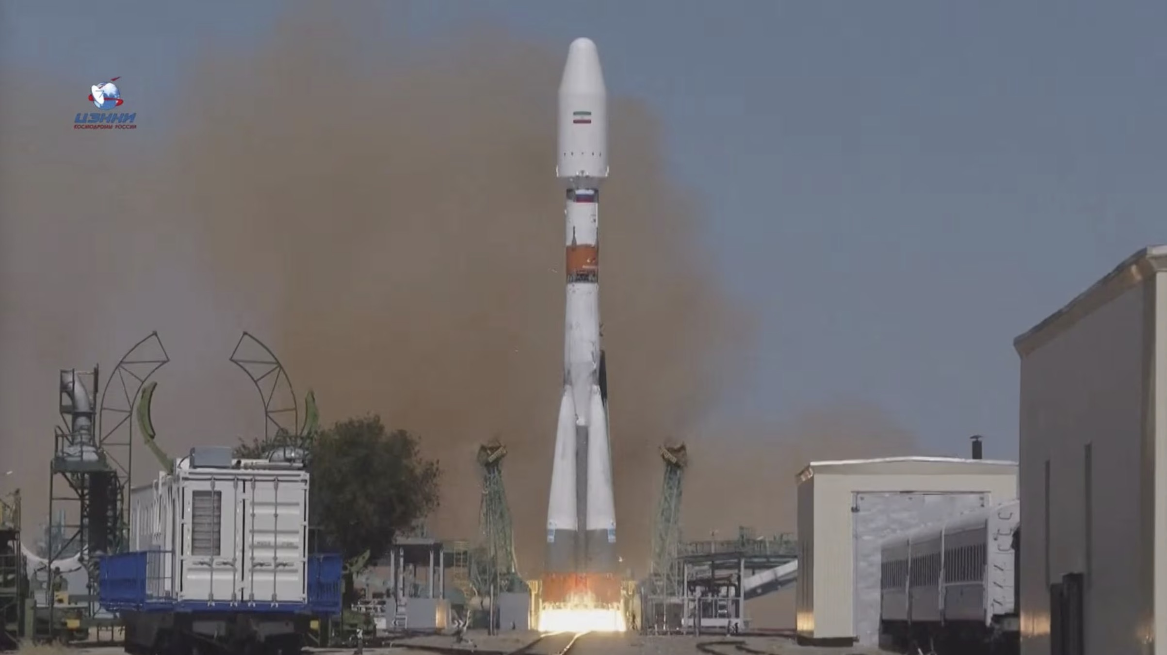 A still image taken from video shows a Soyuz-2.1b rocket booster with the Iranian satellite 