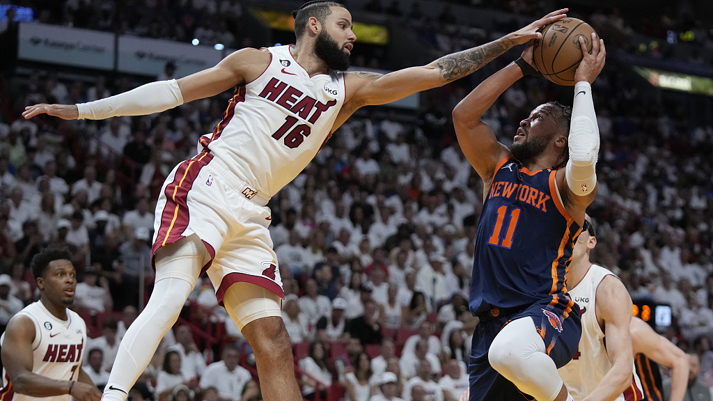 Caleb Martin (#16) of the Miami Heat deflects a shot by Jalen Brunson (#11) of the New York Knicks in Game 3 of the NBA Eastern Conference semifinals at the Kaseya Center in Miami, Florida, May 6, 2023. /CFP