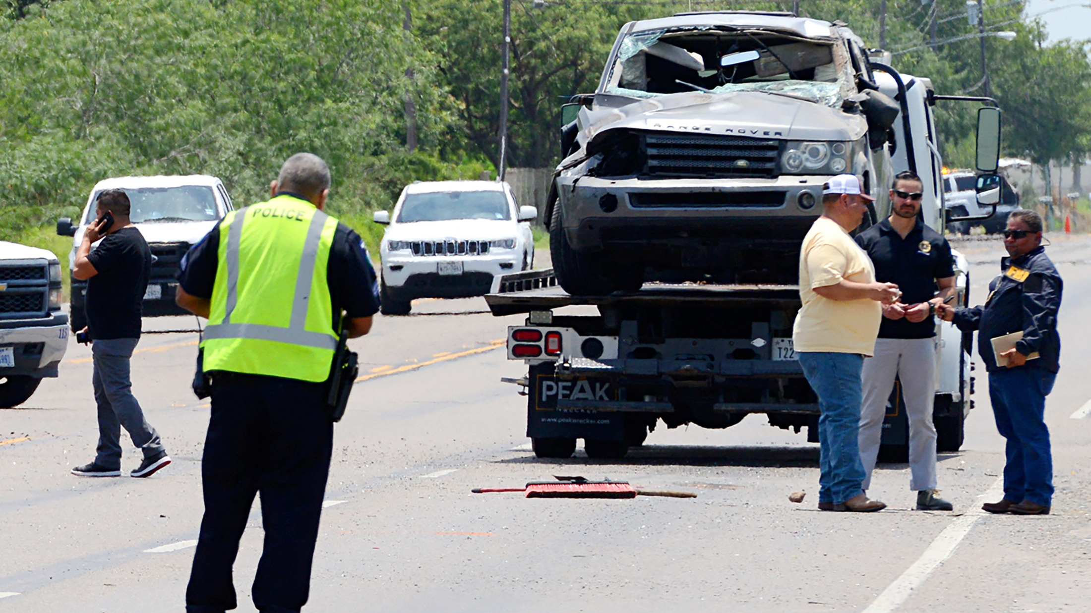 A Range Rover is removed after it ran into pedestrians at a bus stop near the Ozanam Center, a shelter for migrants and homeless, in Brownsville, Texas, U.S., May 7, 2023. /Reuters