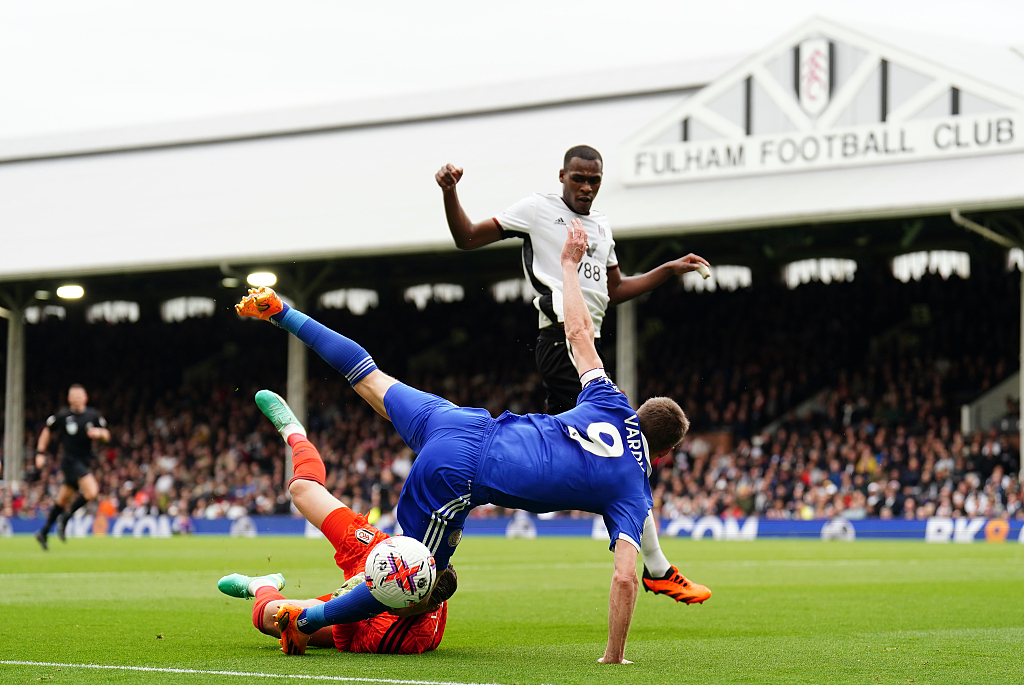 Fulham goalkeeper Bernd Leno fouls Leicester City's Jamie Vardy (#9) to concede a penalty during their Premier League match at Craven Cottage, London, England, May 8, 2023. /CFP