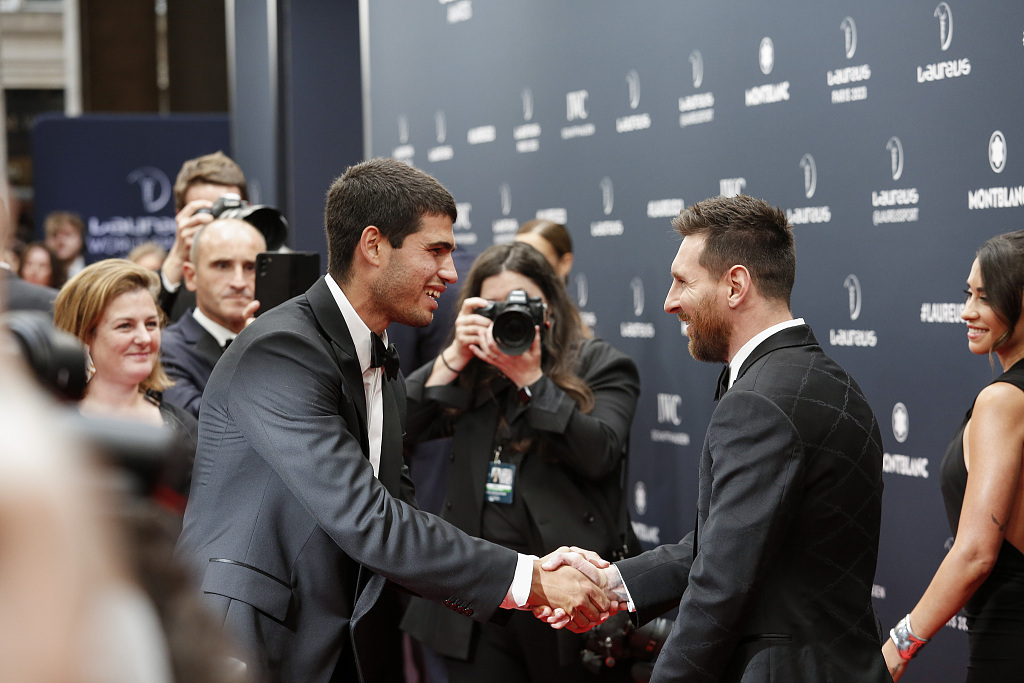 Carlos Alcaraz (L) shakes hands with Lionel Messi on the red carpet during the 2023 Laureus World Sport Awards in Paris, France, May 8, 2023. /CFP
