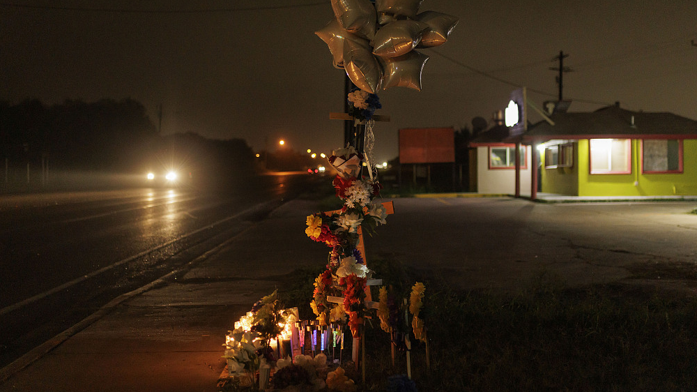 Votive candles, flowers and crosses set up at a memorial for 8 migrants that were run over and killed while waiting at a bus stop in Brownsville, Texas, U.S., May 7, 2023. /CFP