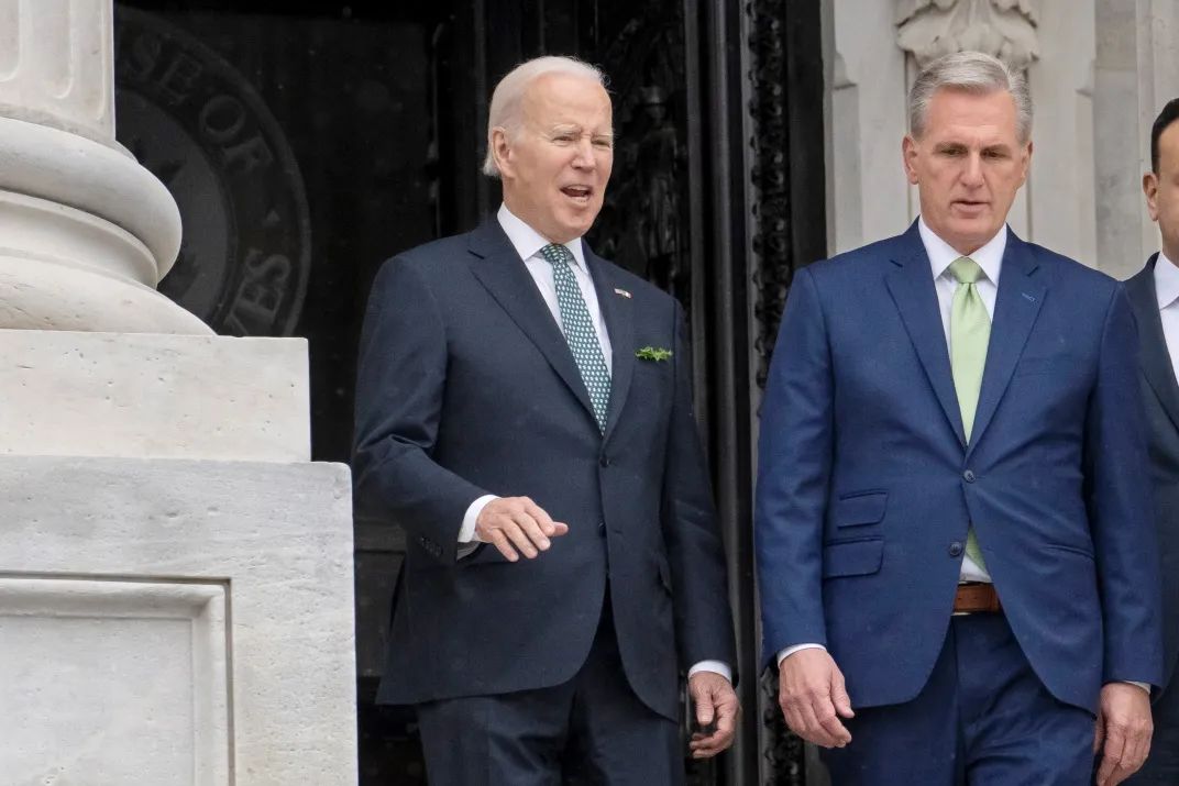 President Joe Biden talks with House Speaker Kevin McCarthy, R-Calif., as he departs the Capitol following the annual St. Patrick's Day gathering, in Washington, March 17, 2023. /AP
