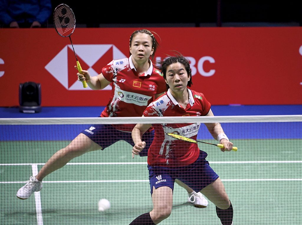 China's Chen Qingchen (L) and Jia Yifan compete in the women's doubles final at the Badminton Sudirman Cup in Vantaa, Finland, October 3, 2021. /CFP 