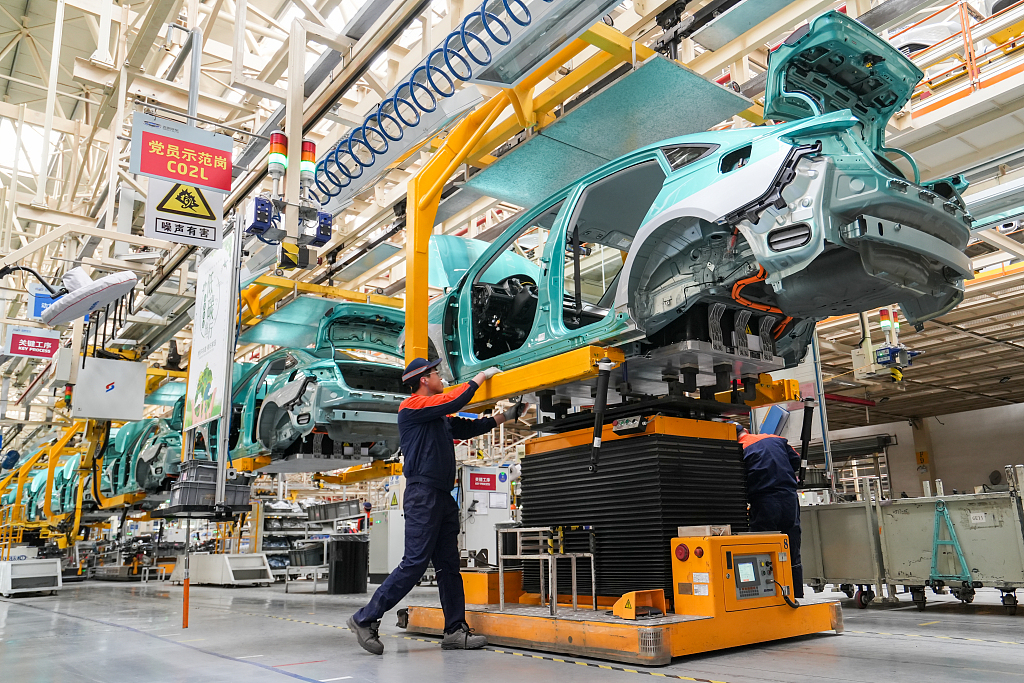 Workers assemble a new energy car in Jinzhong, Shanxi Province, March 25, 2023. /CFP